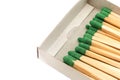 Green matches on a white background. Isolate of matches for lighting a fire in a box Royalty Free Stock Photo