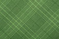 Green material in geometric patterns, a background Royalty Free Stock Photo