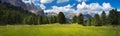 Green meadow with mountains on backgound, the Dolomites Royalty Free Stock Photo