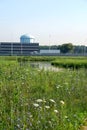 Green meadow and office buildings Royalty Free Stock Photo