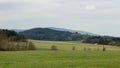 Green meadow, trees with hill Klet and blue sky Royalty Free Stock Photo