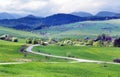 Green meadows above Bobrovnik village Royalty Free Stock Photo