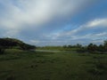 green meadows and beautiful blue sky, landscape view Royalty Free Stock Photo