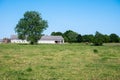 Green meadows, trees and staples at the Flemish countryside around Zogge, Belgium Royalty Free Stock Photo