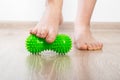 Green medical device for foot massage. Home physiotherapy. Close-up Royalty Free Stock Photo