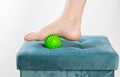 Green medical device for foot massage. Home physiotherapy. Close-up Royalty Free Stock Photo