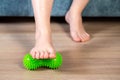 Green medical device for foot massage. Home physiotherapy. Close-up Royalty Free Stock Photo