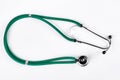 Green medical stethoscope, white background. Royalty Free Stock Photo