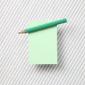 Green memo note pad and green colored pencil on striped pattern fabric background