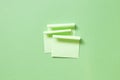 Green memo pad sticky note on green background