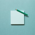 Green memo paper, sticky notes with colored pencil on green background