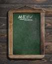 Menu blackboard hanging on wooden wall 3d illustration Royalty Free Stock Photo