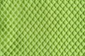 Green mesh over cotton jersey macro texture. Background of light green knitted textile with mesh for casual and sportswear. Modern Royalty Free Stock Photo