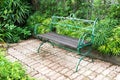 Green metal curved steel bench in the park Royalty Free Stock Photo