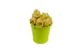 Green metal bucket and dry Gigli or campanelle pasta on white ba Royalty Free Stock Photo