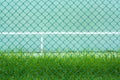 Green metal cage front the green tennis court and wall for practice Royalty Free Stock Photo