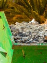 Metal container with construction waste rubble Royalty Free Stock Photo