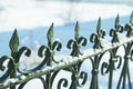 Green metal decorative fence in the snow Royalty Free Stock Photo