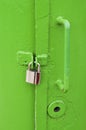Locked green metal door on lighthouse