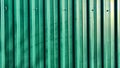 Green Metal fence with vertical picket fence and lines. Abstract background, frame, texture with place for text and copy Royalty Free Stock Photo