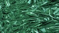 Green metal foil, wrinkled and shiny. Close-up, abstract image background Royalty Free Stock Photo