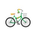 Green metal kid bicycle with yellow seat and front basket Royalty Free Stock Photo