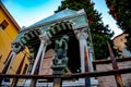 Green metal lion as decoration on old and rusty wrought iron fence in Bologna, Italy Royalty Free Stock Photo