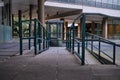 Green metal railings along ramp in 60s development