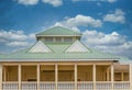 Green Metal Roof on Yellow Building