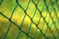 Green metallic chain link fence in perspective Royalty Free Stock Photo