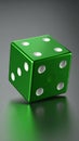 Green metallic dice with white pips on a reflective dark surface with soft lighting Royalty Free Stock Photo