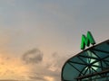 Green metro sign on the visor of entrance