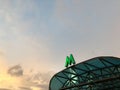 Green metro sign on the visor of entrance