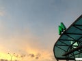 Green metro sign on the visor of entrance