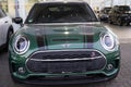 green Mini Cooper BMW of automotive concern BMW Group closeup, British Motor Corporation BMÃÂ¡ in showroom, car dealership,