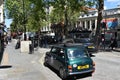 Green Mini Moris. Oldtimer, small on London streets Royalty Free Stock Photo