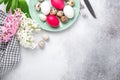 Green mint plate with easter eggs and hyacinths on stone background. Easter concept. Flat lay Royalty Free Stock Photo