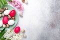 Green mint plate with easter eggs and hyacinths on stone background. Easter concept. Flat lay Royalty Free Stock Photo