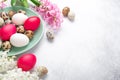 Green mint plate with easter eggs and hyacinths on stone background. Easter concept Royalty Free Stock Photo