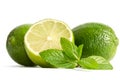 Green mint, two limes with half of a juicy lime Royalty Free Stock Photo