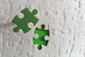 Green Missing Puzzle Piece Concept Symbolizing Solution and Completion Royalty Free Stock Photo
