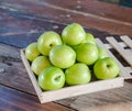 Green monkey apple put on wooden table Royalty Free Stock Photo