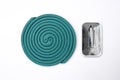 Green mosquito coil with metal stand. Mosquito coil. Mosquito repellent coil