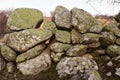 Green moss on stone background and texture. Old stone wall covered with moss. Royalty Free Stock Photo