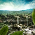 Green moss stone with exotic waterfall background. Mountains and cloudy sky background. Royalty Free Stock Photo
