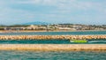 Green motor boat entering the harbour in Lagos, Portugal