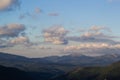 Green mountain hills and blue cloudy sky landscape