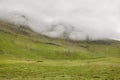 Green mountain landscape foggy day in Faroe islands. Kalsoy