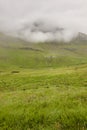 Green mountain landscape foggy day in Faroe islands. Kalsoy