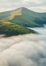 Green Mountain Peak Above the Clouds Royalty Free Stock Photo